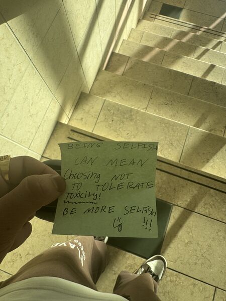 Handwritten sticky note with words of encouragement